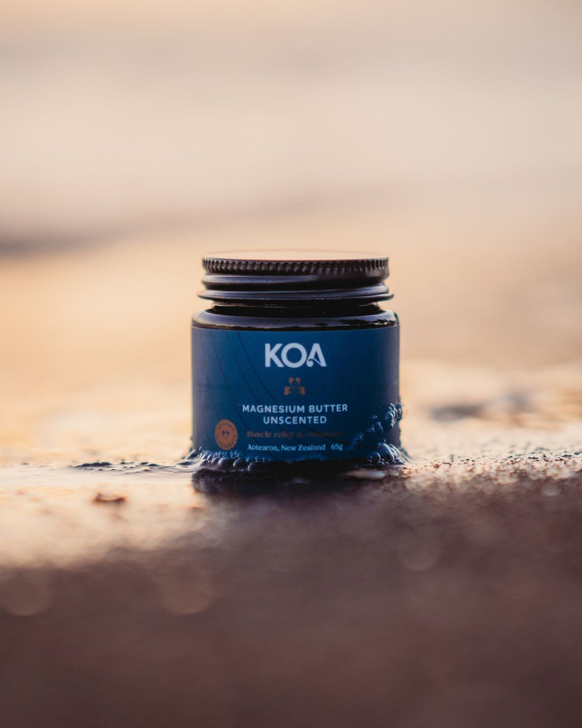 Magnesium Butter Unscented on sand at beach